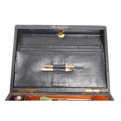 390 - Early 20th century writing slope / desk tidy. Of rectangular form leather bound, on a hinged lid. Op... 