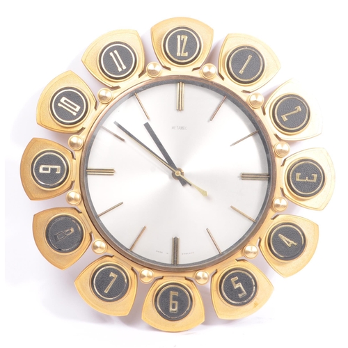 392 - A 1960s mid 20th Century Metamec wall clock having a silver face, yellow metal hour finials to the c... 