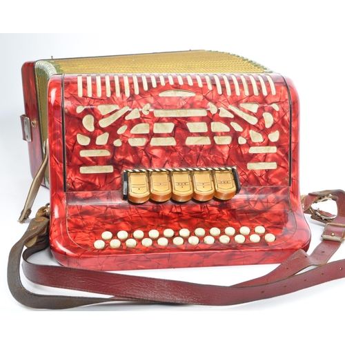 402 - Hohner - A German Hohner Amatona IV button musical instrument accordion DeLuxe. Having a red marble ... 