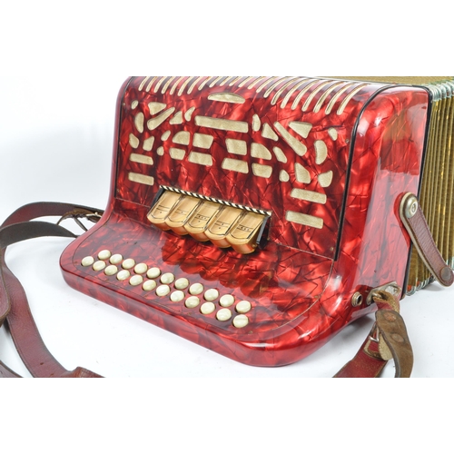 402 - Hohner - A German Hohner Amatona IV button musical instrument accordion DeLuxe. Having a red marble ... 