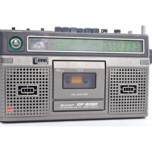 403 - Sharp - A vintage 20th century portable stereo cassette player. Model number GF-8080 with dual speak... 