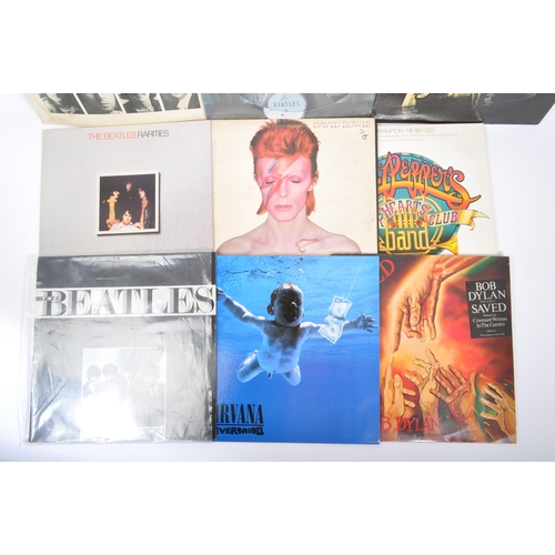 412 - A collection of 20th century 45rpm vinyl records LPs. The collection to include Saved - Bob Dylan, R... 