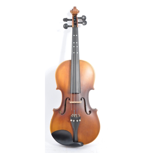 421 - A contemporary wooden acoustic Eastar violin. The violin being full sized, having a plastic chin res... 