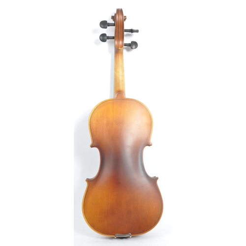 421 - A contemporary wooden acoustic Eastar violin. The violin being full sized, having a plastic chin res... 