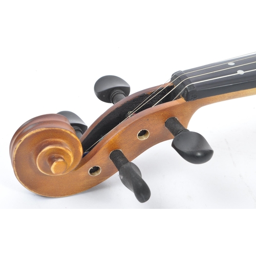 421 - A contemporary wooden acoustic Eastar violin. The violin being full sized, having a plastic chin res... 