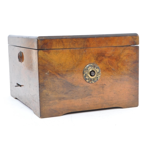 423 - A 19th century German walnut cased symphonium. With hinged lid, bearing inlaid label Symphonion to e... 