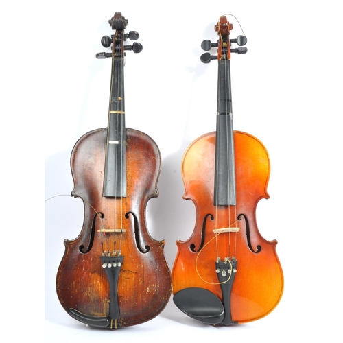 425 - A late 19th century circa 1890s violin, alongside another late 20th century example. The violin of w... 