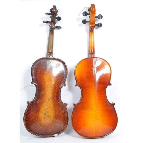 425 - A late 19th century circa 1890s violin, alongside another late 20th century example. The violin of w... 