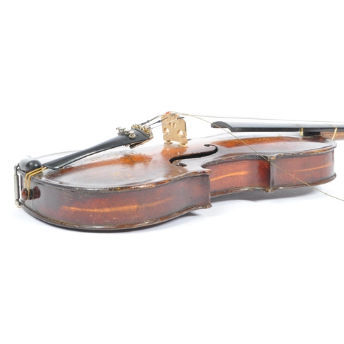 425 - A late 19th century circa 1890s violin, alongside another late 20th century example. The violin of w... 