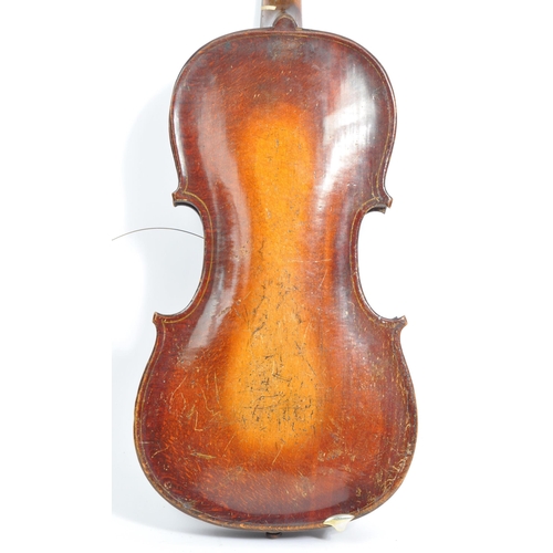 425 - A late 19th century circa 1890s violin, alongside another late 20th century example. The violin of w... 