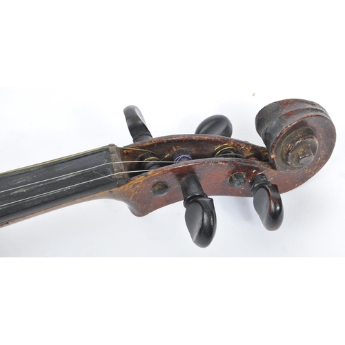 425 - A late 19th century circa 1890s violin, alongside another late 20th century example. The violin of w... 