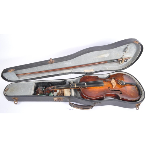 425 - A late 19th century circa 1890s violin, alongside another late 20th century example. The violin of w... 