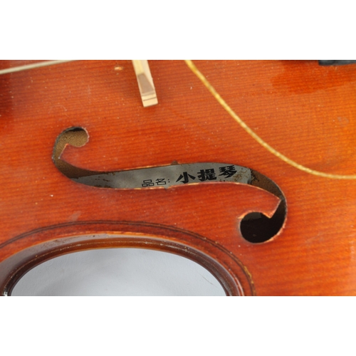 425 - A late 19th century circa 1890s violin, alongside another late 20th century example. The violin of w... 