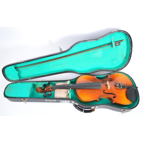 425 - A late 19th century circa 1890s violin, alongside another late 20th century example. The violin of w... 