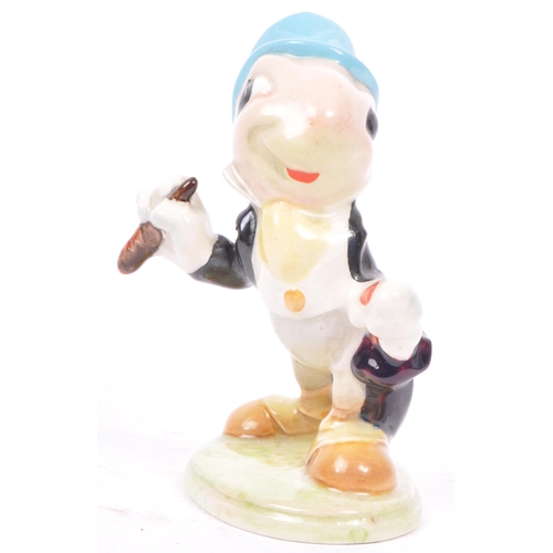 43 - A 20th century Beswick Walt Disney gold stamp Jiminy Cricket figurine together with a Wade of Englan... 