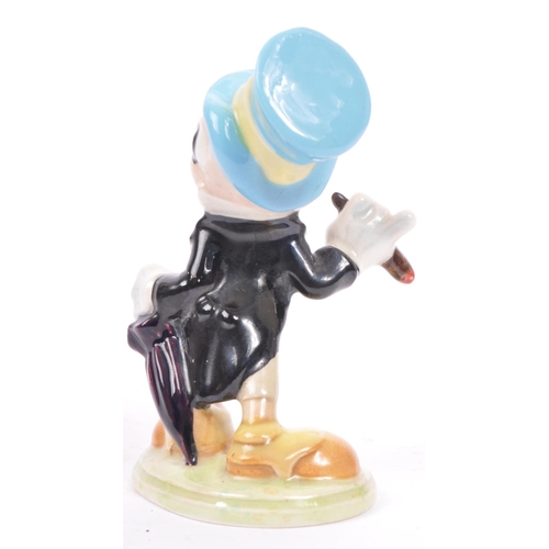 43 - A 20th century Beswick Walt Disney gold stamp Jiminy Cricket figurine together with a Wade of Englan... 