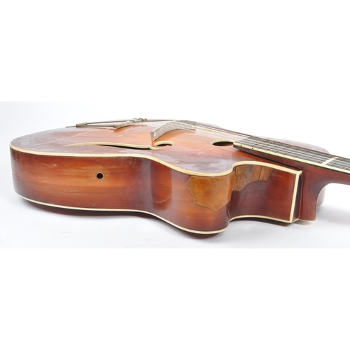 434 - A mid 20th century circa 1950s Melodija Rolyford archtop guitar. The guitar having a shaped hollow w... 