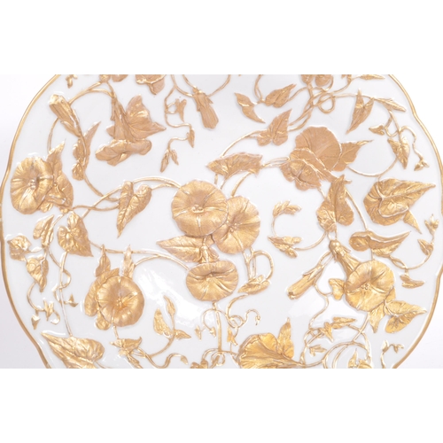 44 - An early 20th century German Meissen porcelain relief molded gold gilt floral bowl. The bowl having ... 