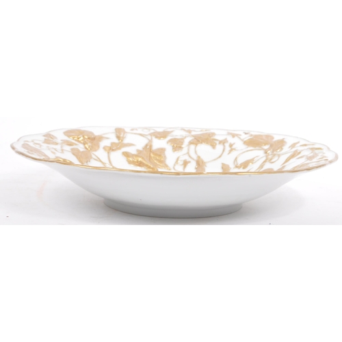 44 - An early 20th century German Meissen porcelain relief molded gold gilt floral bowl. The bowl having ... 