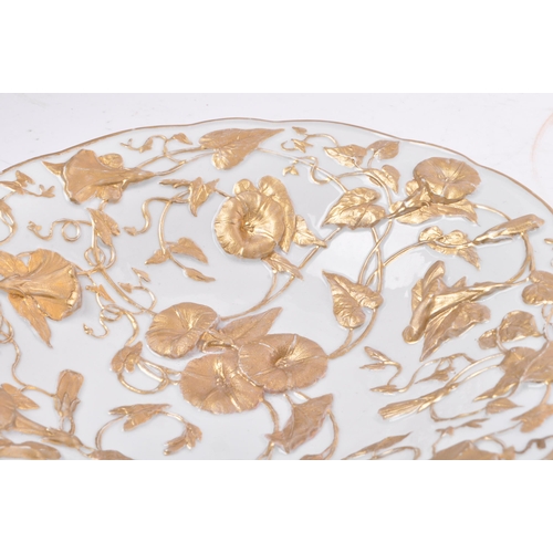 44 - An early 20th century German Meissen porcelain relief molded gold gilt floral bowl. The bowl having ... 