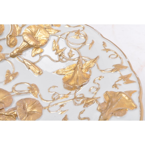 44 - An early 20th century German Meissen porcelain relief molded gold gilt floral bowl. The bowl having ... 