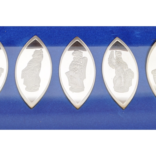 443 - A boxed set of ten Sterling Silver lozenge shaped white metal ingots titled 'The Queens Beasts' - pr... 