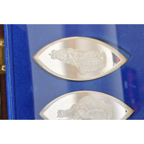 443 - A boxed set of ten Sterling Silver lozenge shaped white metal ingots titled 'The Queens Beasts' - pr... 