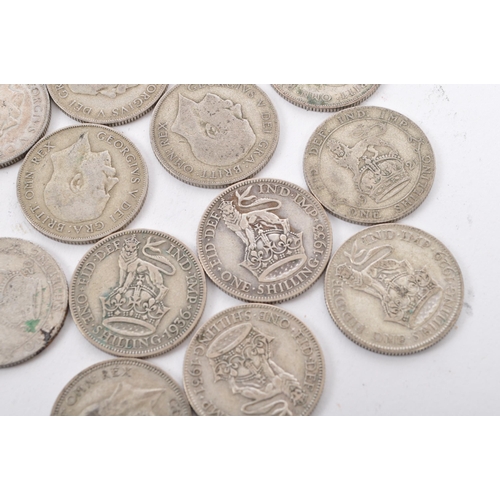 463 - A collection of approximately thirty early 20th century (pre 1947) .500 silver George V shillings. T... 