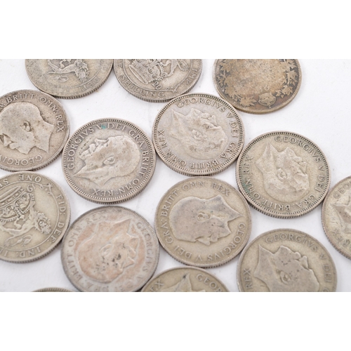 463 - A collection of approximately thirty early 20th century (pre 1947) .500 silver George V shillings. T... 