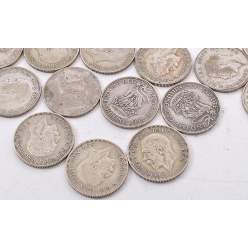 464 - A collection of approximately thirty early 20th century (pre 1947) .500 silver George V shillings. T... 