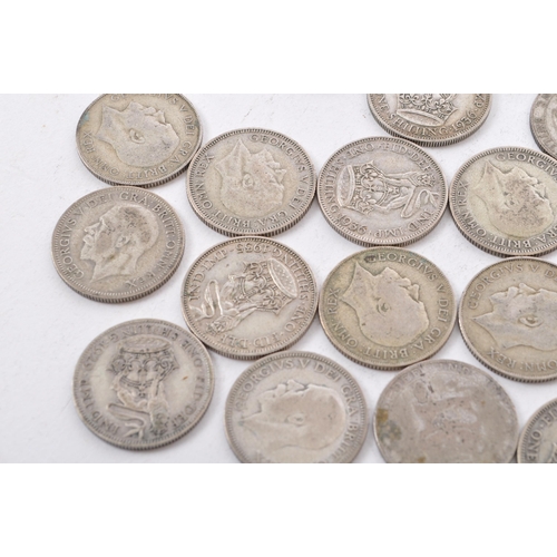 464 - A collection of approximately thirty early 20th century (pre 1947) .500 silver George V shillings. T... 