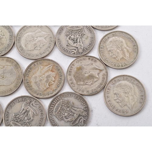 464 - A collection of approximately thirty early 20th century (pre 1947) .500 silver George V shillings. T... 