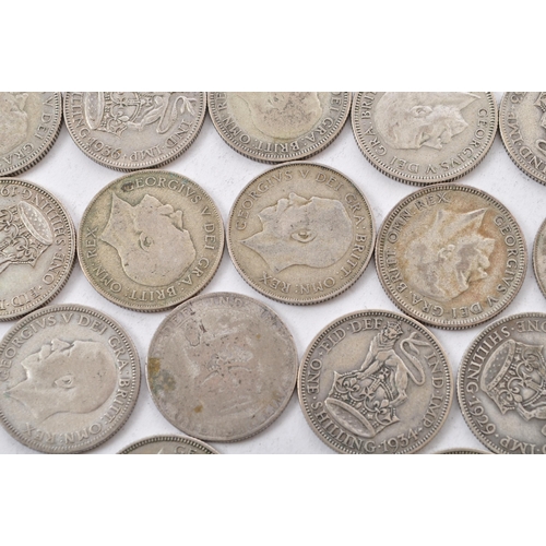 464 - A collection of approximately thirty early 20th century (pre 1947) .500 silver George V shillings. T... 