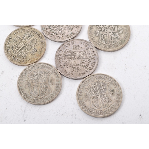 472 - A collection of five George V and three George VI circulated silver half crown coins. The lot to inc... 