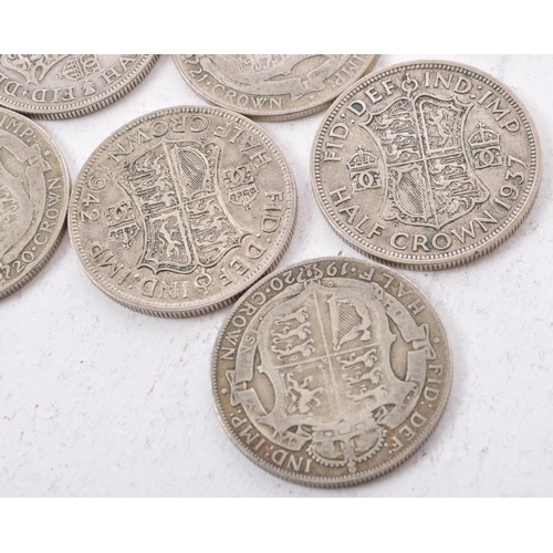 473 - A collection of six George V and two George VI circulated silver half crown coins. The lot to includ... 