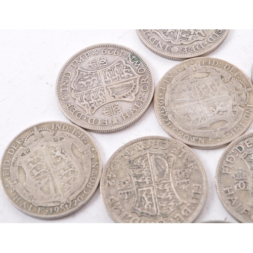 473 - A collection of six George V and two George VI circulated silver half crown coins. The lot to includ... 