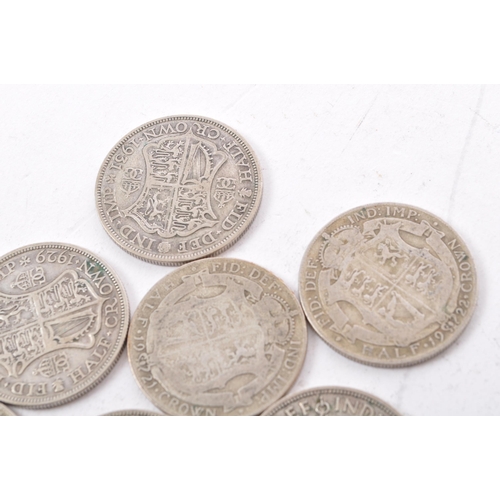 473 - A collection of six George V and two George VI circulated silver half crown coins. The lot to includ... 