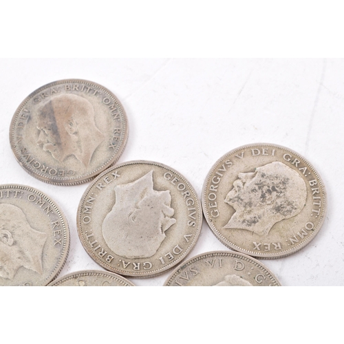 473 - A collection of six George V and two George VI circulated silver half crown coins. The lot to includ... 