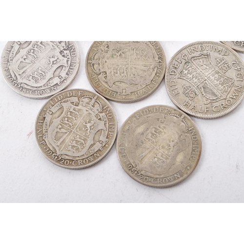 474 - A collection of six George V and two George VI circulated silver half crown coins. The lot to includ... 