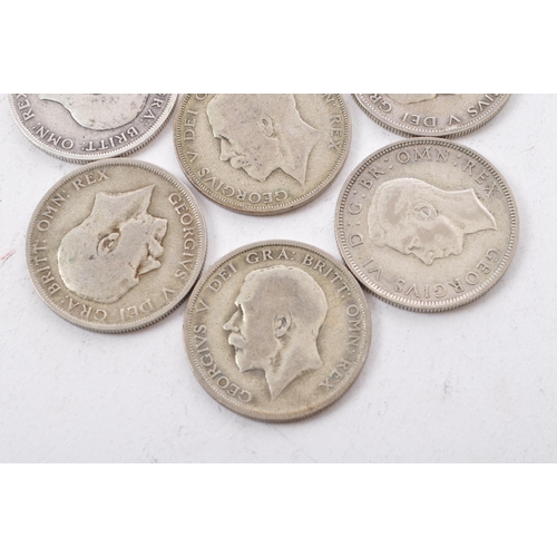 474 - A collection of six George V and two George VI circulated silver half crown coins. The lot to includ... 