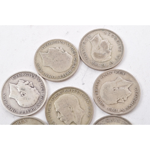 474 - A collection of six George V and two George VI circulated silver half crown coins. The lot to includ... 