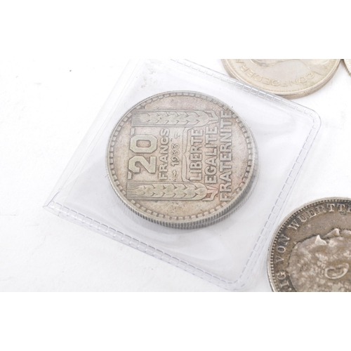 486 - A collection of 19th and 20th century European, French, German, Swiss, and Belgian currency / silver... 