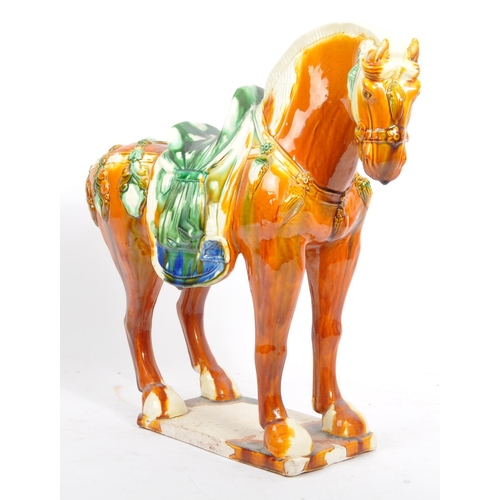 54 - A retro mid 20th century Chinese ceramic pottery horse statue / figure. Of tall standing position dr... 