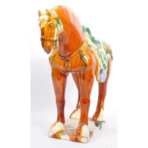 54 - A retro mid 20th century Chinese ceramic pottery horse statue / figure. Of tall standing position dr... 