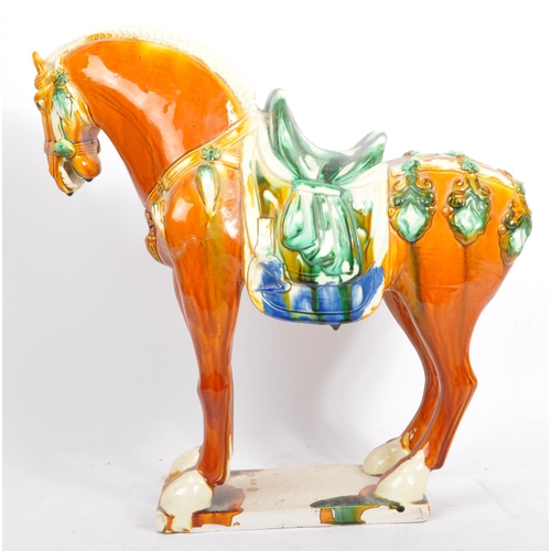 54 - A retro mid 20th century Chinese ceramic pottery horse statue / figure. Of tall standing position dr... 