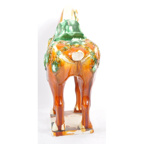 54 - A retro mid 20th century Chinese ceramic pottery horse statue / figure. Of tall standing position dr... 