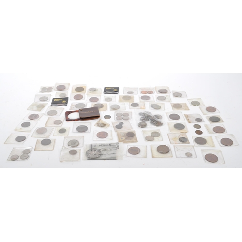 541 - A collection of early to late 20th century United Kingdom and foreign uncirculated currency coins. I... 