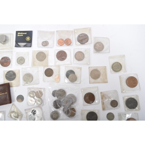 541 - A collection of early to late 20th century United Kingdom and foreign uncirculated currency coins. I... 