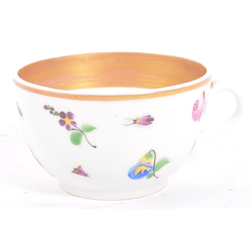 6 - A 19th century Polish / Poland Korzec china porcelain cup & saucer. With hand painted insects and fl... 