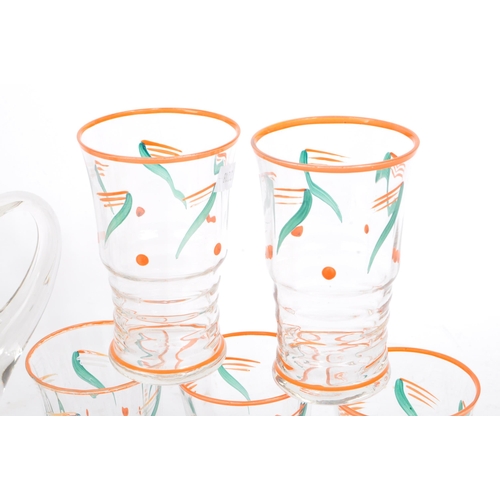 61 - A vintage mid 20th century lemonade set. With hand painted jug and with five drinking tumblers / gla... 